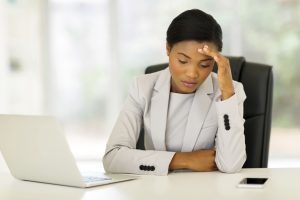 stressed female employee worker overworked wellness health mental