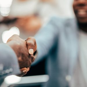 image of a handshake of business executives leadership team meeting