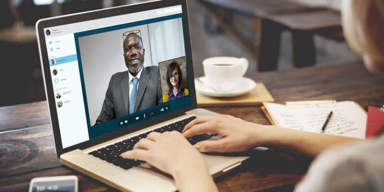 3 Key Attributes of Successful Remote Leaders remote workers laptop virtual meeting workplace