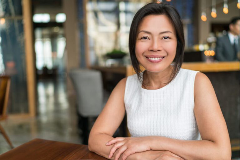 female employee sitting in workplace environment leadership leader