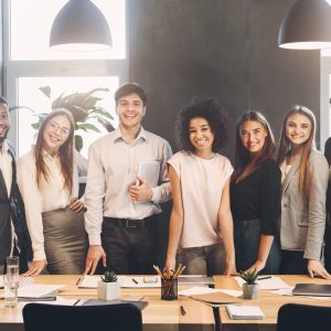 Successful managers posing and looking at camera in office