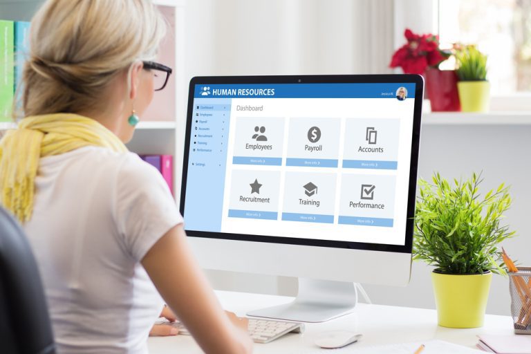 Woman working with human resources software on computer Streamlining workflow with API for human resource management