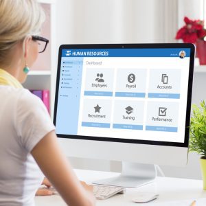 Woman working with human resources software on computer Streamlining workflow with API for human resource management