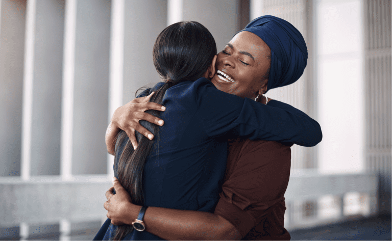 women supporting each other showing compassion and love in the workplace