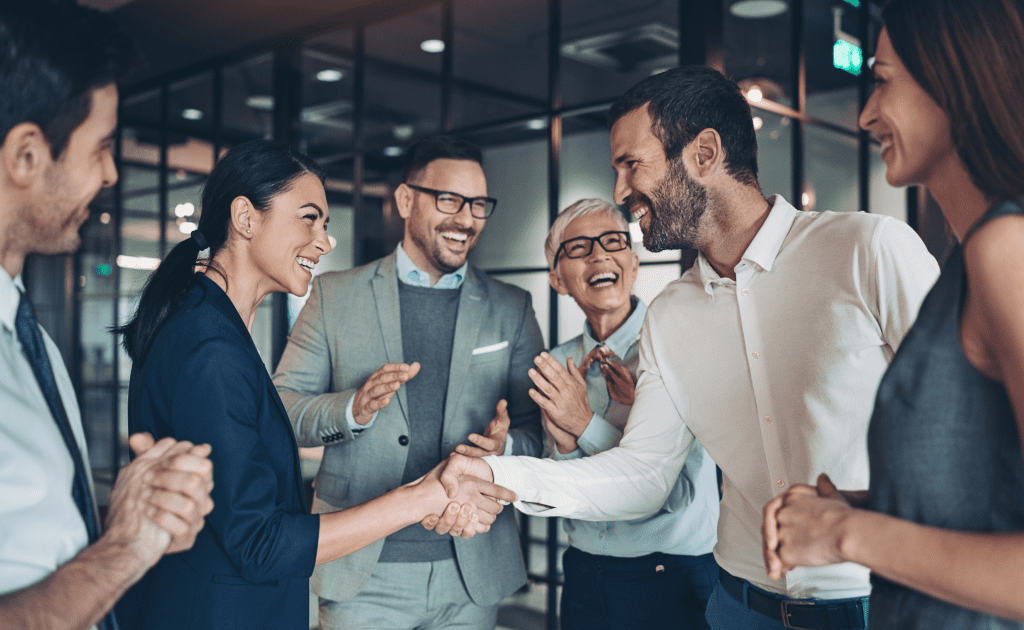 team happy shaking hands celebrate strategy leadership leaders engaging with employees