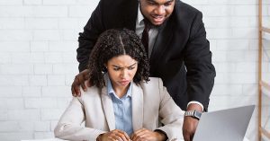 A female employee being sexually harassed by a male employee and making her feel uncomfortable and not safe in the workplace emotionally or mentally