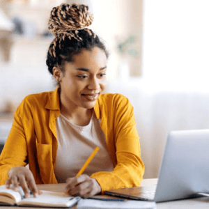 woman learning digitally to improve her skills in the workplace so she can work up the corporate ladder and become a leader