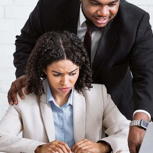 A female employee being sexually harassed by a male employee and making her feel uncomfortable and not safe in the workplace emotionally or mentally