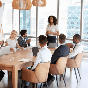 A team meeting with a diverse set of employees, attending to important issues within the business that need to be addressed on how to ensure success in their company