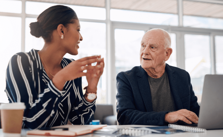 different generations working in the office together baby boomer and millennial and gen x gen z working together in harmony accepting each other