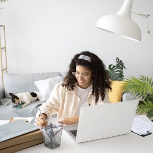 medium-shot-woman-working-desk-with-laptop-remote working working from home employees employers