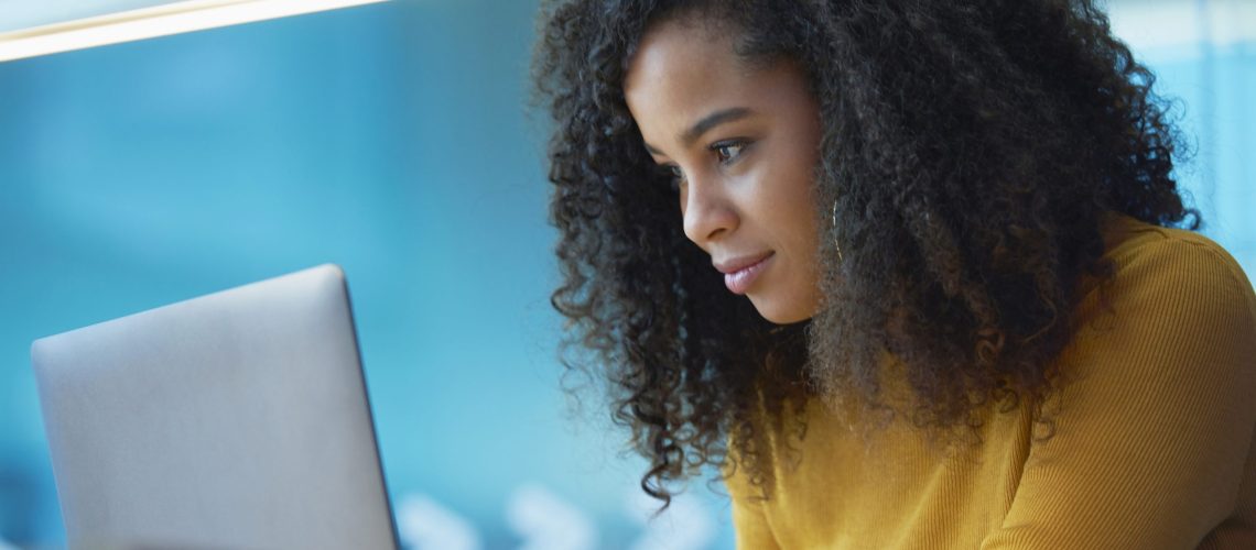 young woman on laptop in office