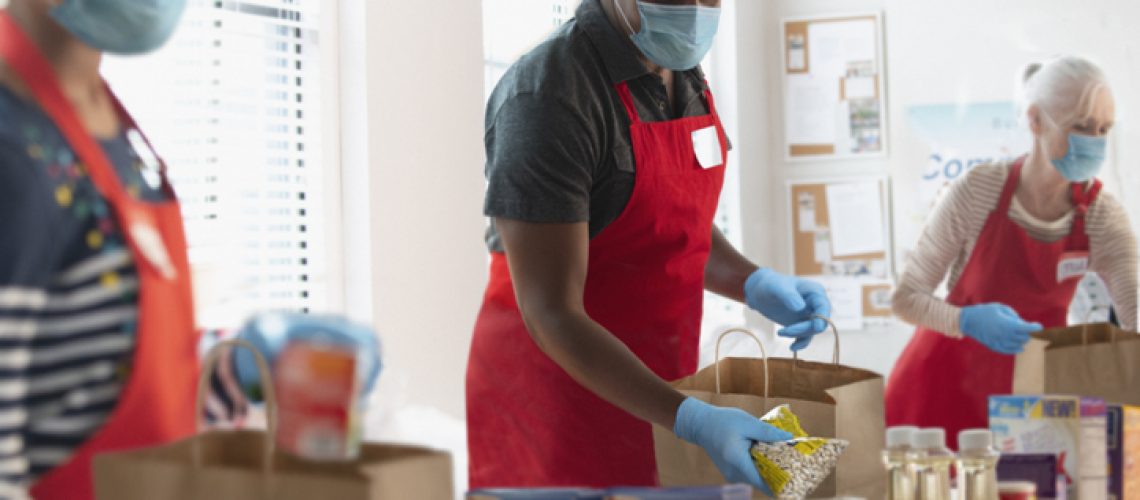 Group of volunteer people donating groceries