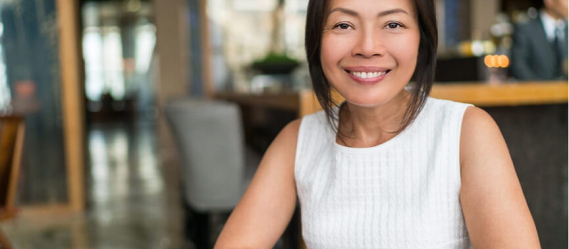 female employee sitting in workplace environment leadership leader