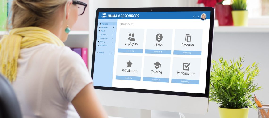 Woman working with human resources software on computer Streamlining workflow with API for human resource management