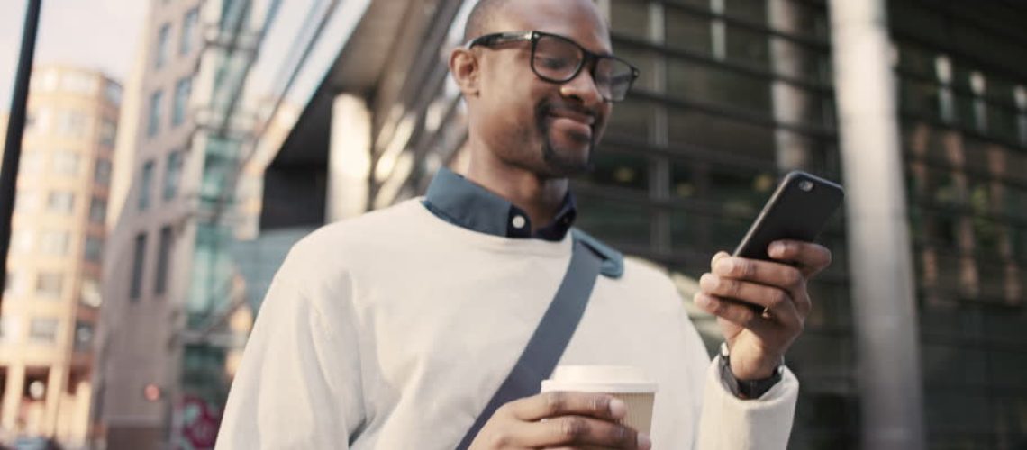 Businessman_on_his_cellphone_with_coffee