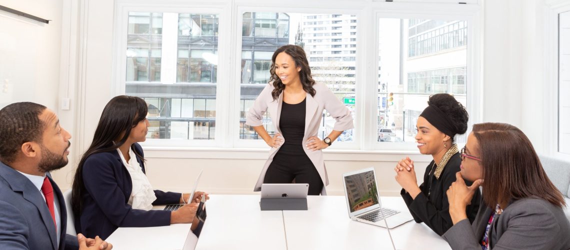 Women in the workplace meeting together and talking about how to get employees to work together effectively and productively in their performance of disruption