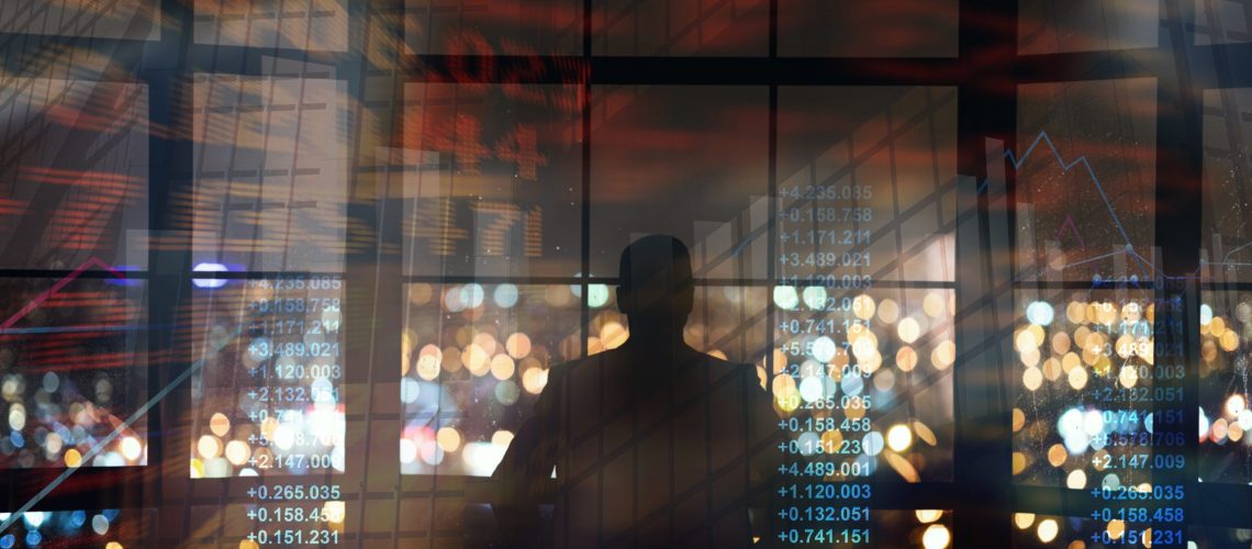 Silhouette of businessman looking on night metropolis, collage with finance info on imaginary screen. Panorama