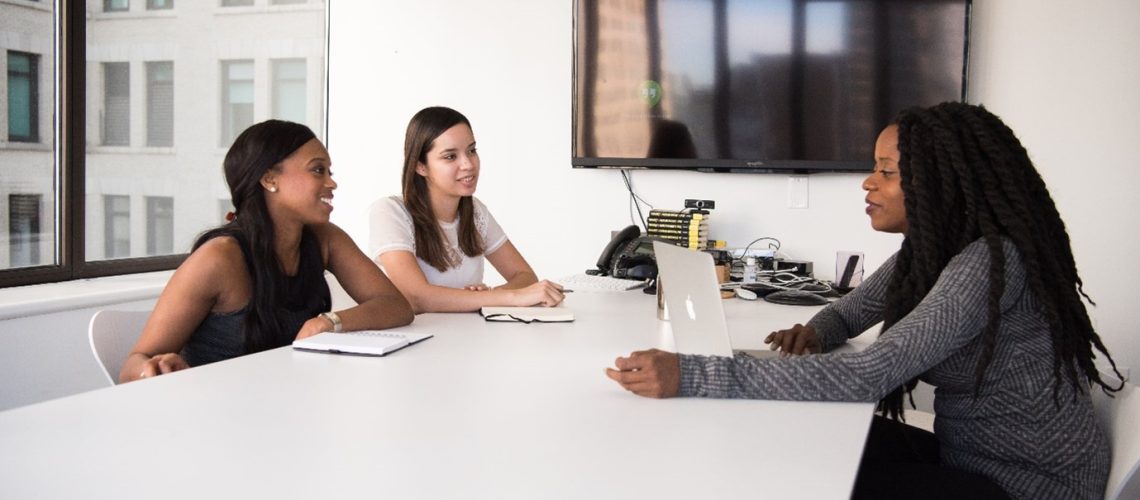 female employees working together in a meeting to achieve tasks