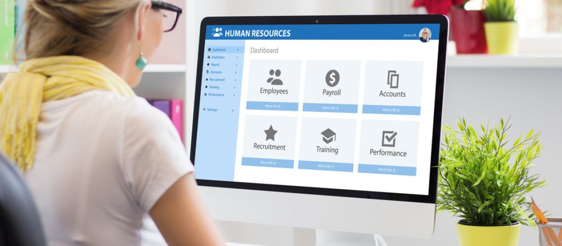 Woman working with human resources software on computer Streamlining workflow with API for human resource management