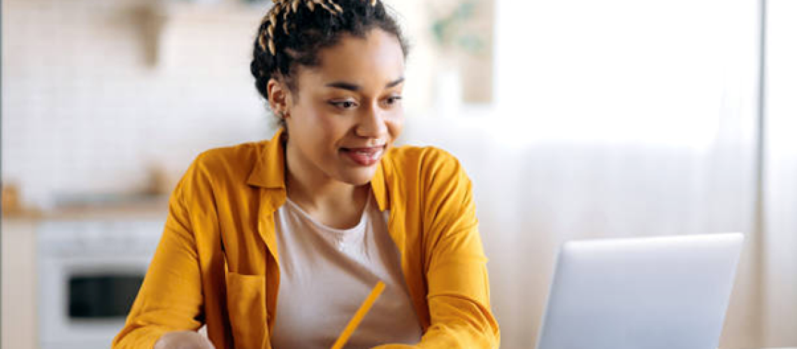 woman learning digitally to improve her skills in the workplace so she can work up the corporate ladder and become a leader