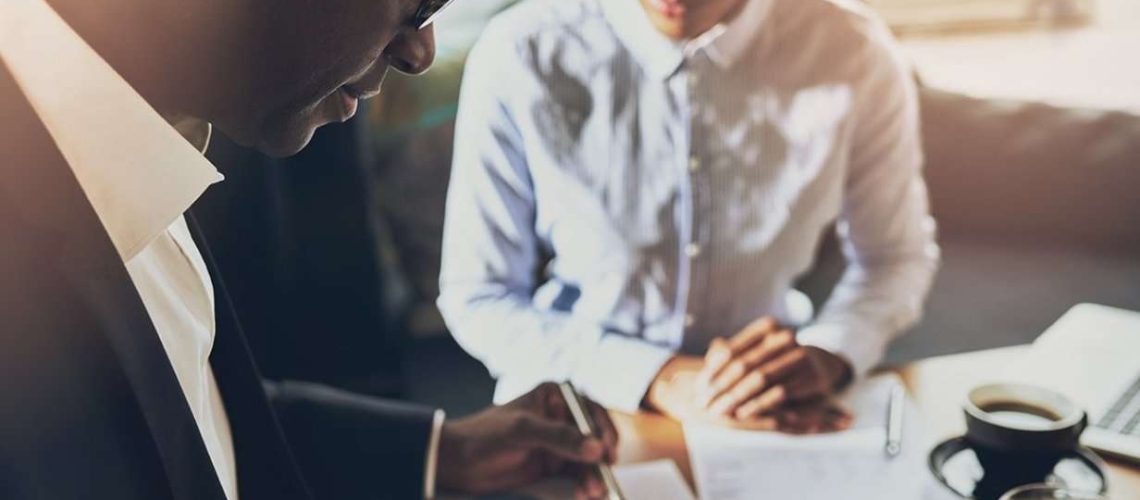 buisness_man_and_woman_looking_over_work_together