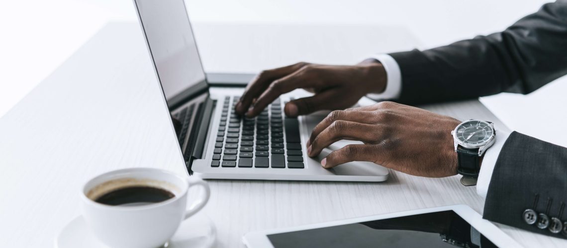 businessman on laptop with coffee