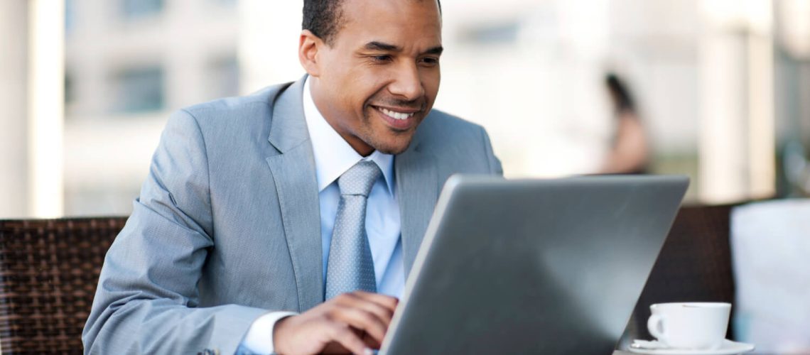 businessman_at_his_desk_with_laptop