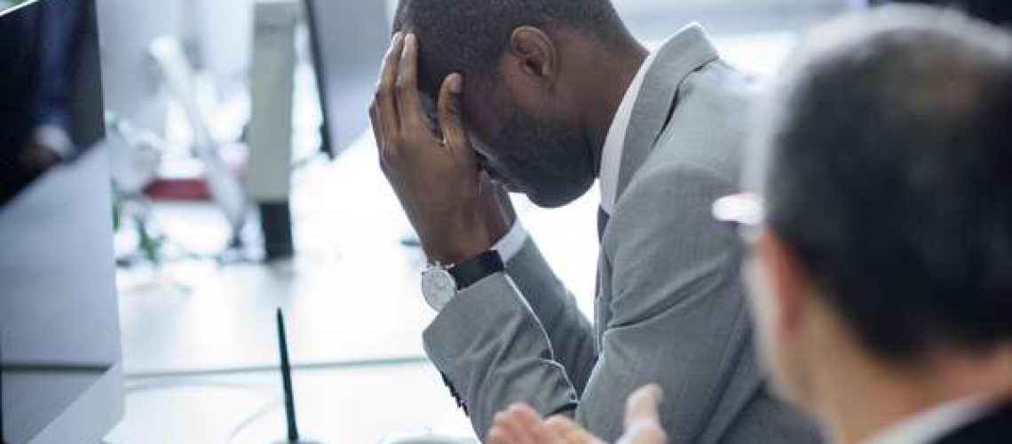 businessman_head_in_hands_stressed mental health wellness wellbeing team argument bad leadership