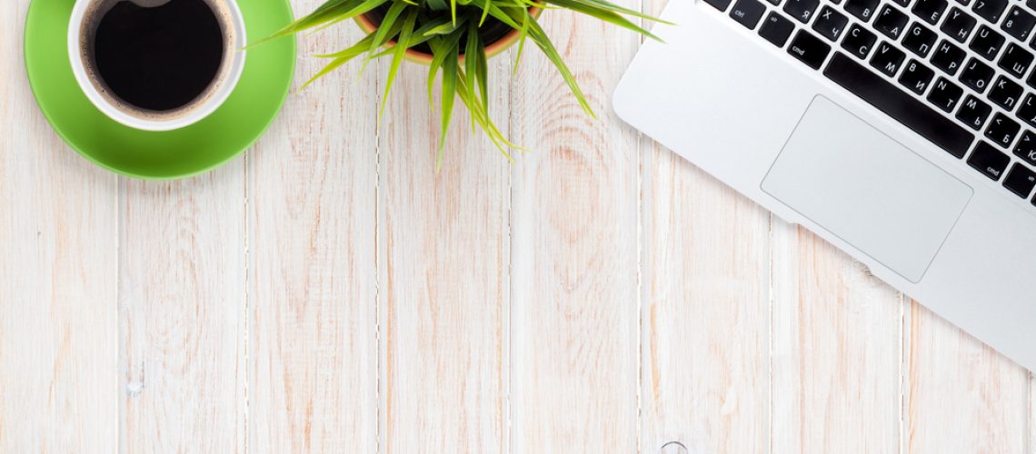 desk_with_laptop_coffee_and_plant