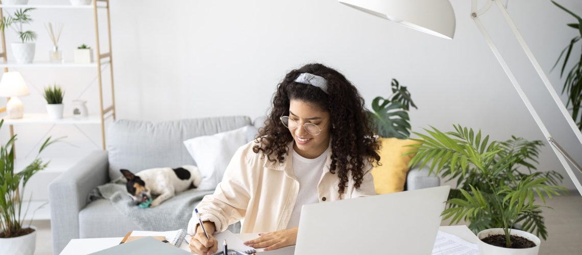 medium-shot-woman-working-desk-with-laptop-remote working working from home employees employers