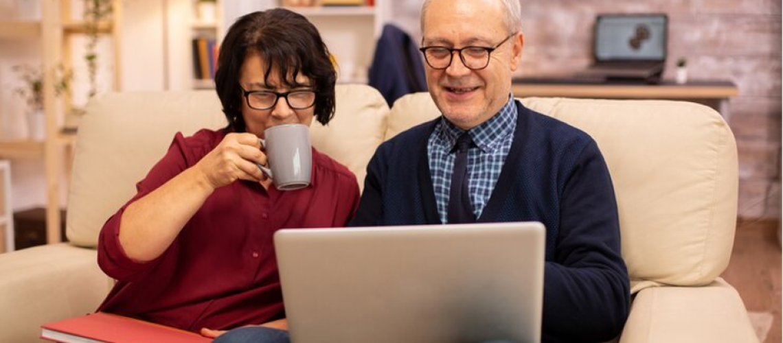 senior employees working on laptop