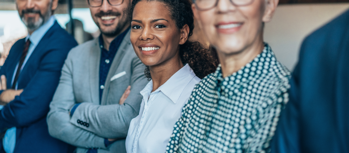 team of employees smiling together