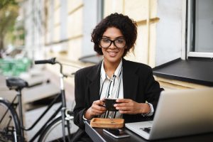 gig economy woman working at coffee shop remote working