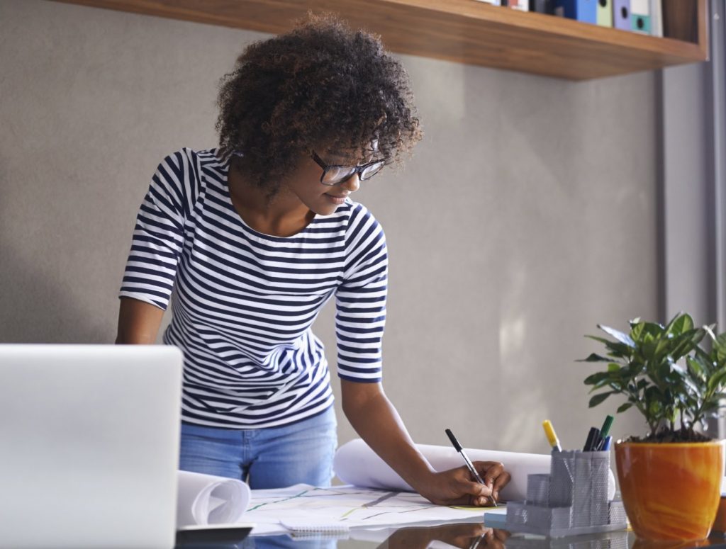 business_woman_working_happy_laptop_and_writing_down