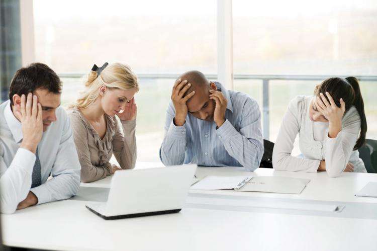 stressful_group_of_business_people unhappy wellness wellbeing mental health team resilience caring for employees teams